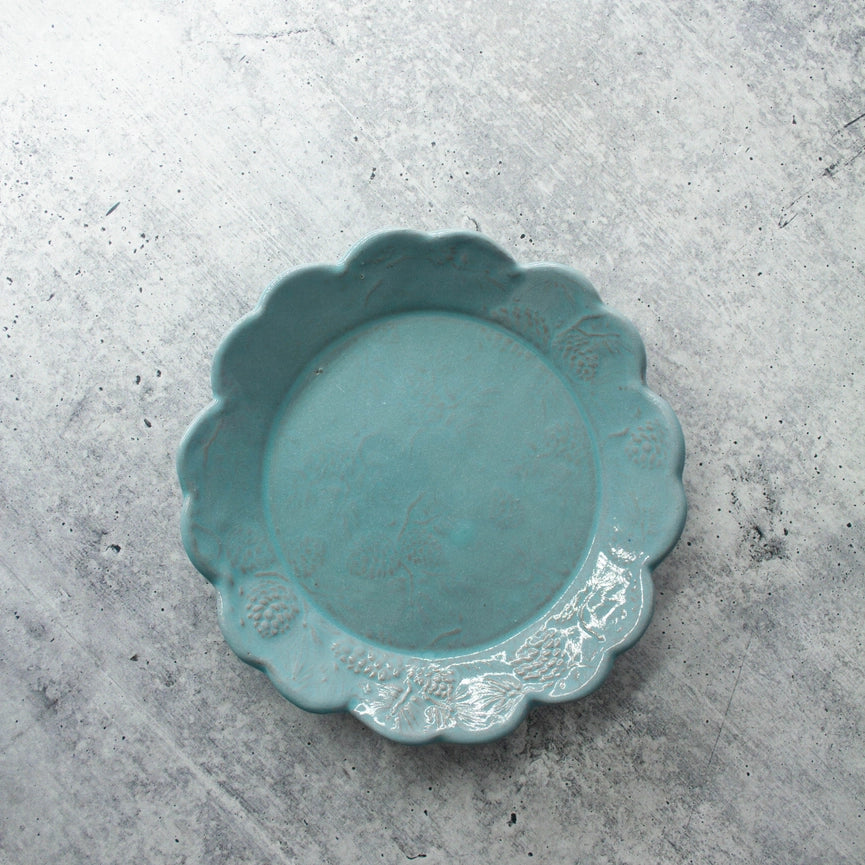 turquoise bread and butter plate scalloped edge round on gray background
