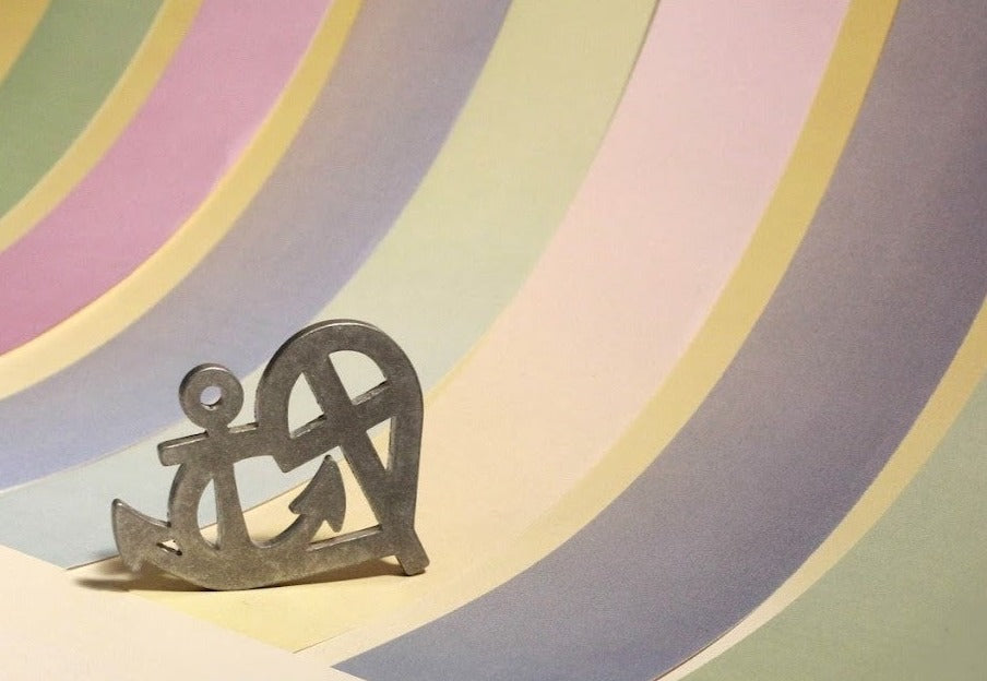 metal faith love hope pendant wit striped background