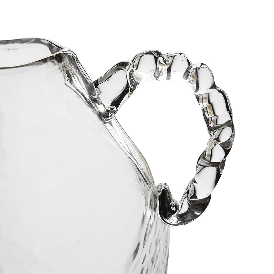 Close-up of a clear glass vase on a white background