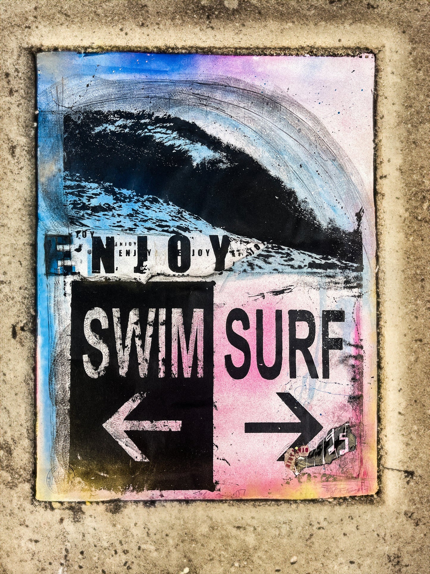 Artistic sign with 'Enjoy Swim Surf' text and directional arrows on a textured background