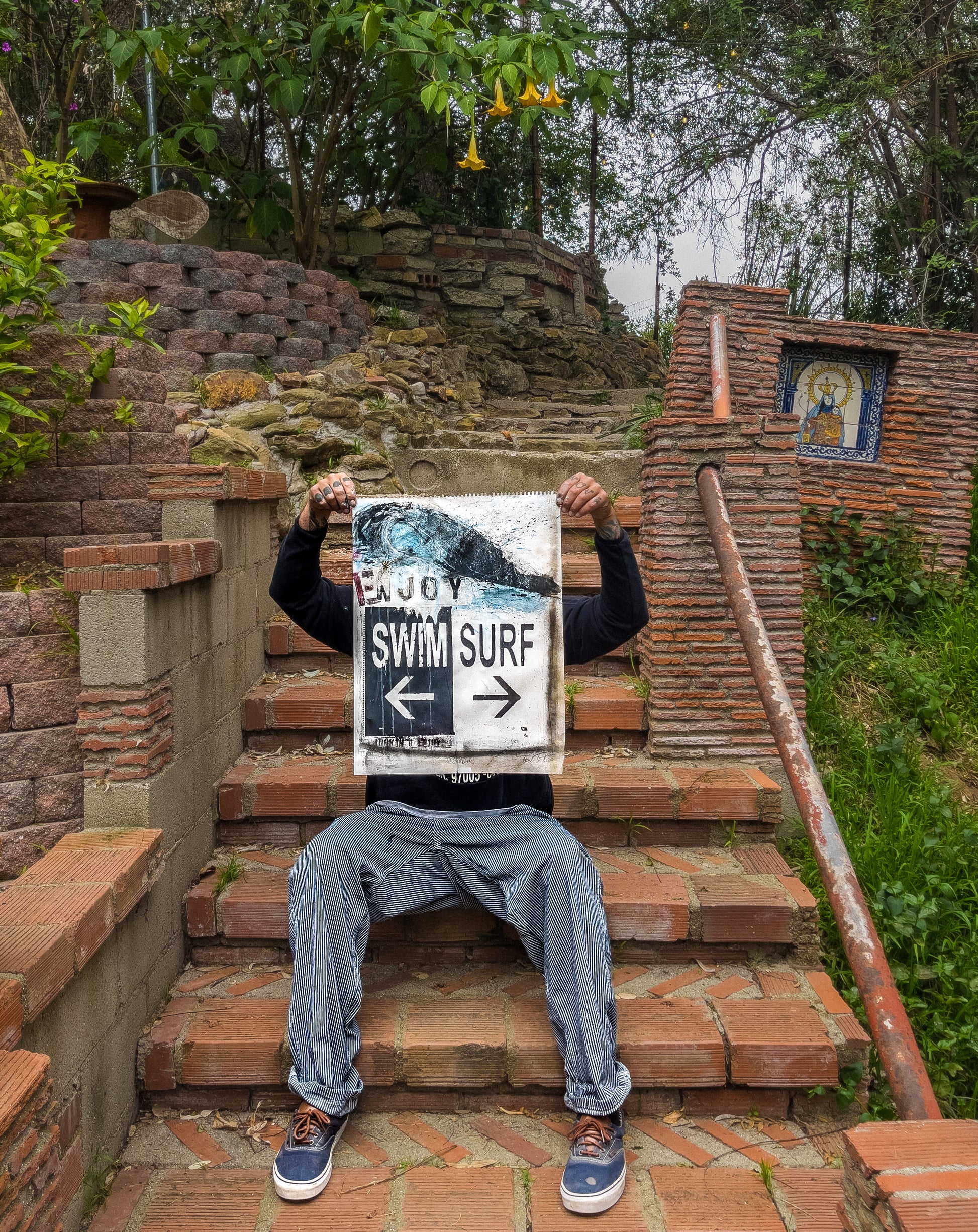 artist holding swim surf repeat print