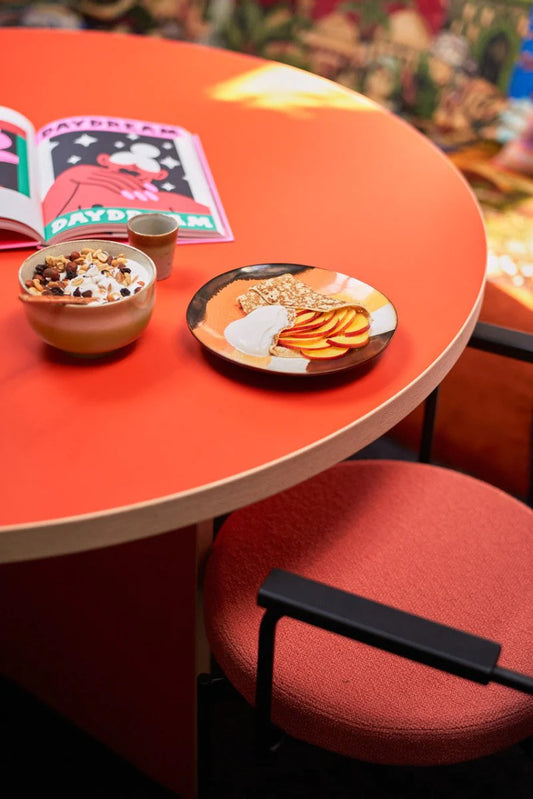 retro style side plates with retro wave in orange brown yellow and cream on orange table
