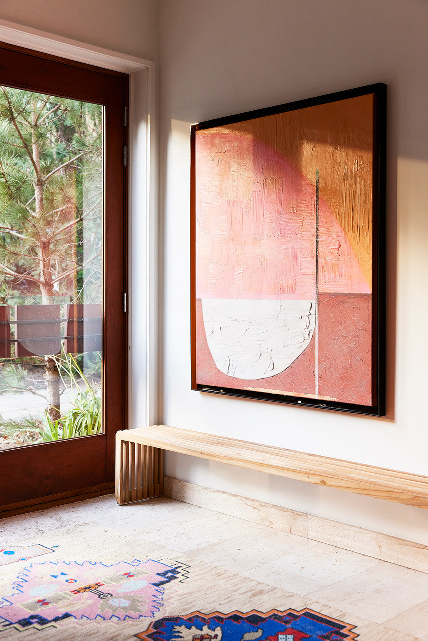 abstract painting with brown acrylic shadow box in a hallway with a teak wooden slatted bench