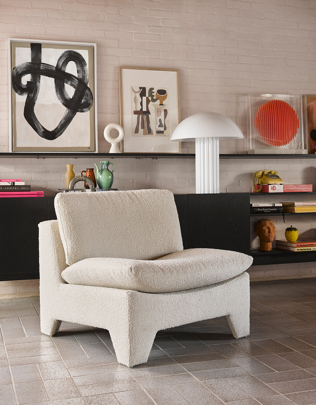 retro style modern interior with boucle lounge chair and white cupola mushroom table lamp