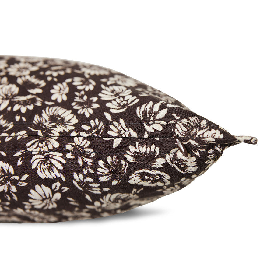detail of brown vintage style lumbar pillow with white flowers