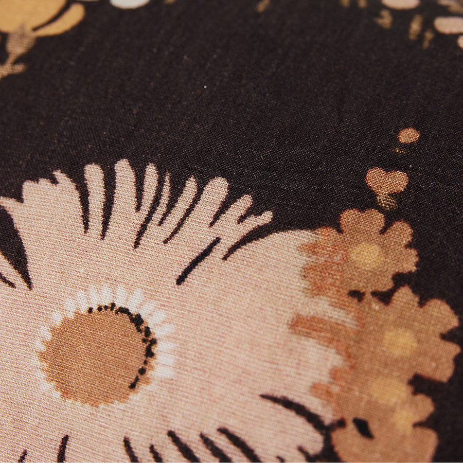 close up vintage inspired lumbar pillow with flower print