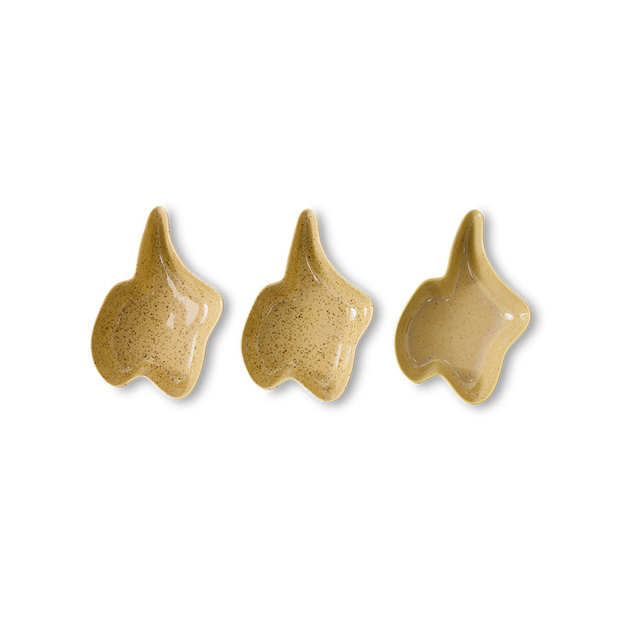 Three ceramic star-shaped dishes on a white background