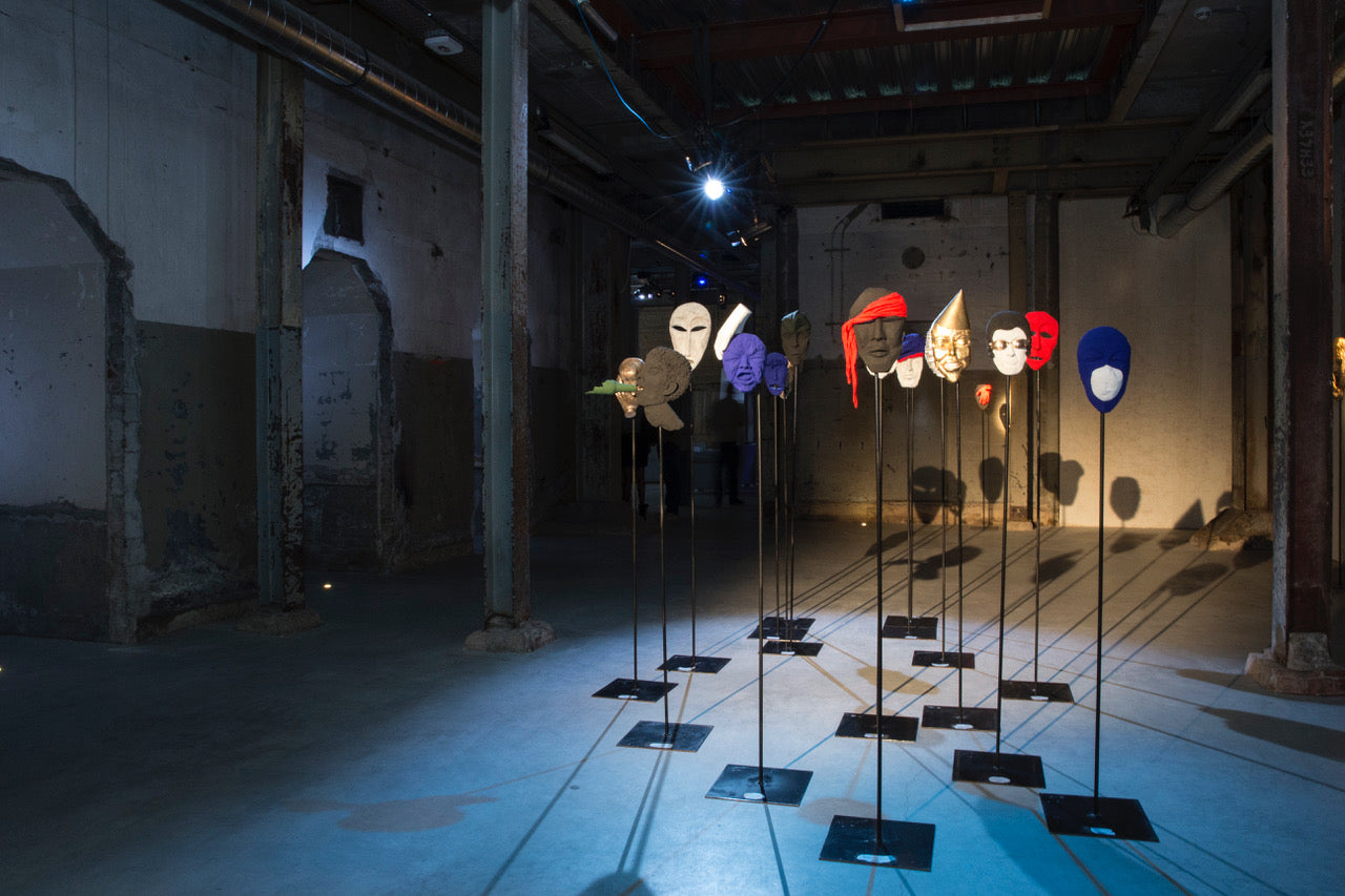 bronze sculptures on stands in room