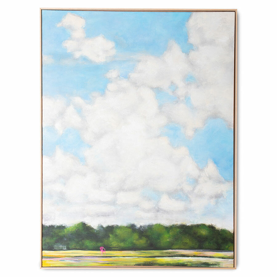 large painting of blue sky with large clouds and a green field with a pink chair
