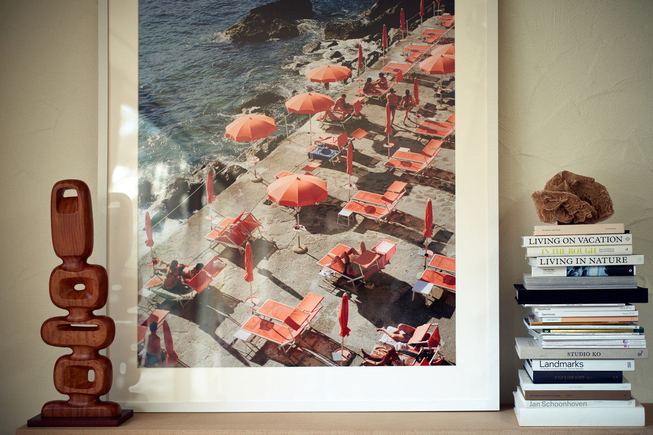 framed photo of orange sun umbrellas along the Amalfi coast