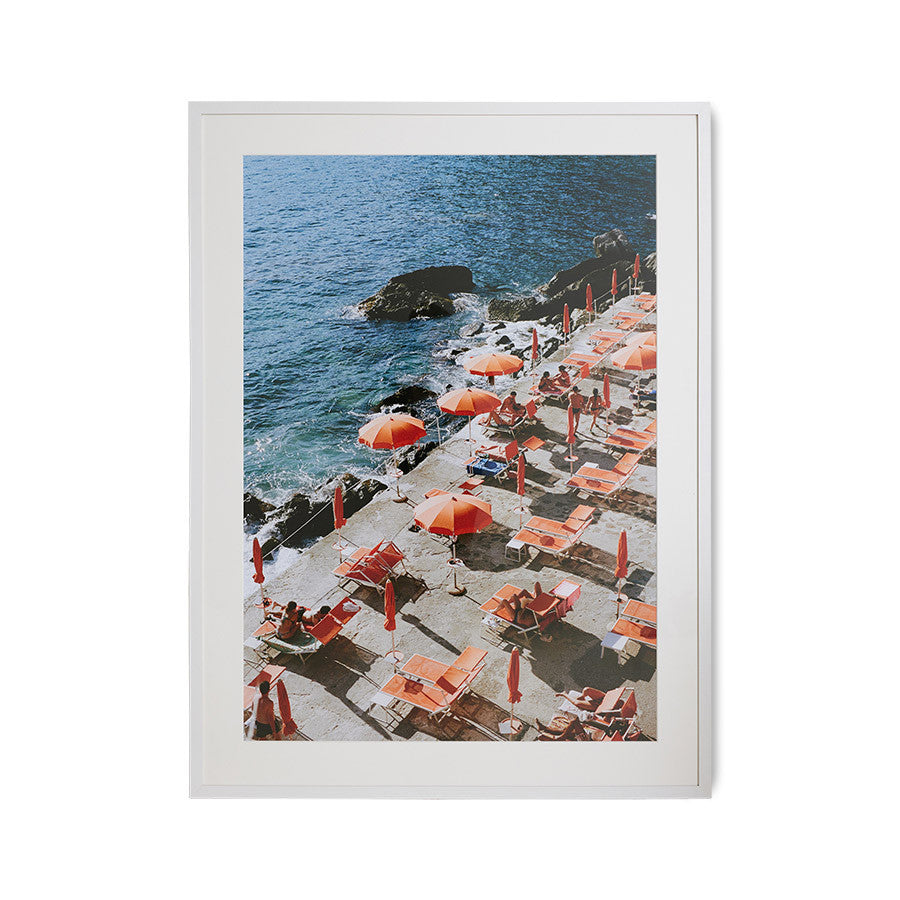 framed photo of orange sun umbrellas along the Amalfi coast