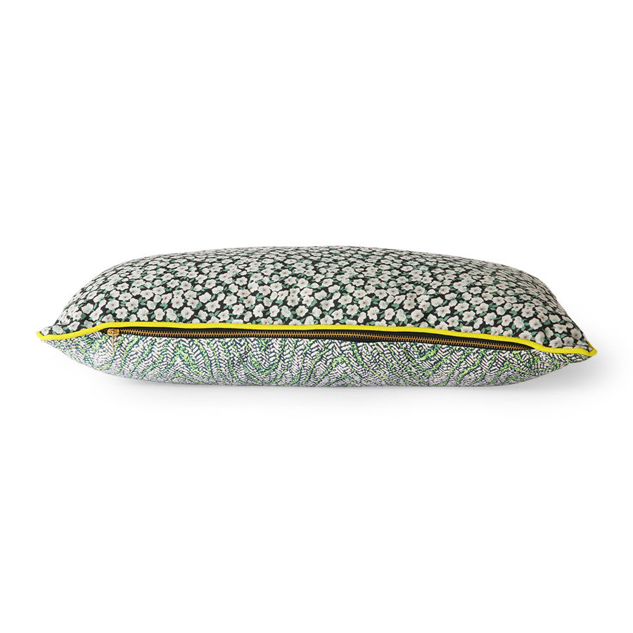 green printed pillow with yellow trim piping