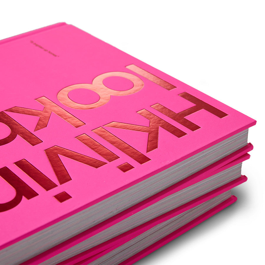 detail of stack of 3 hardcover bright pink  HKliving look book