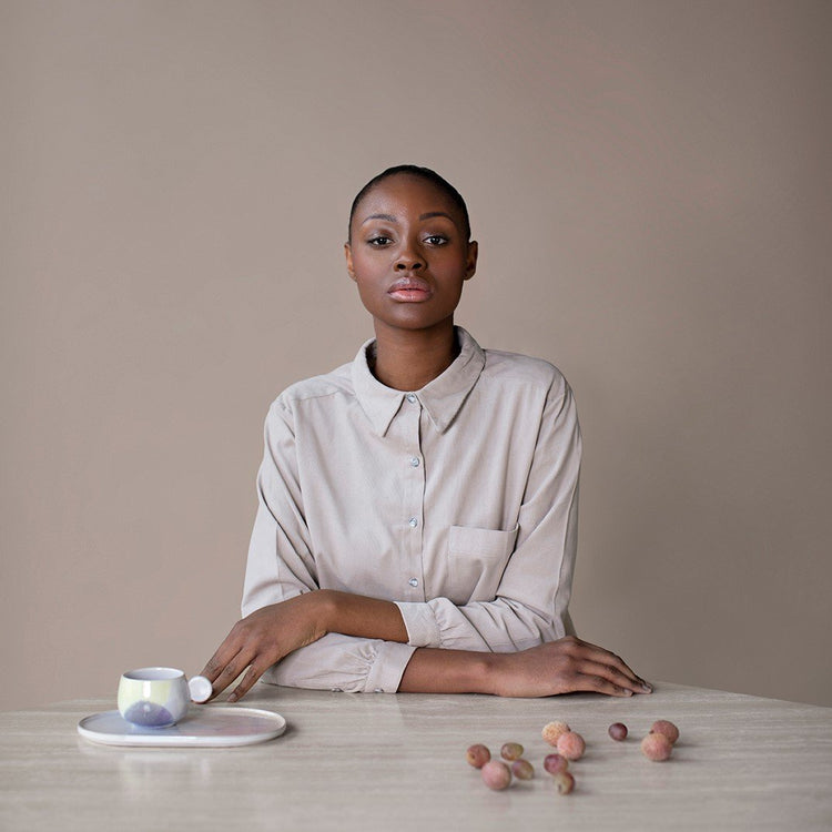 woman sitting at a table 