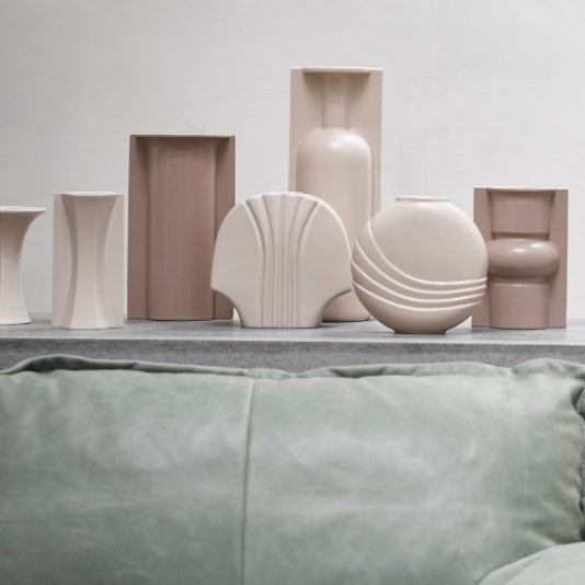 group of skin colored sculptural flower vases