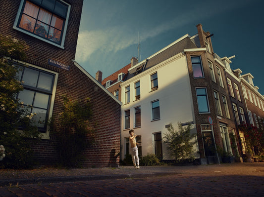houses with boy running in street