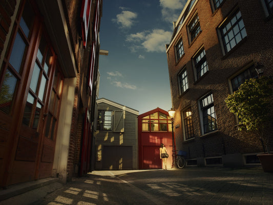 Narrow street with brick buildings and a person walking in the evening.