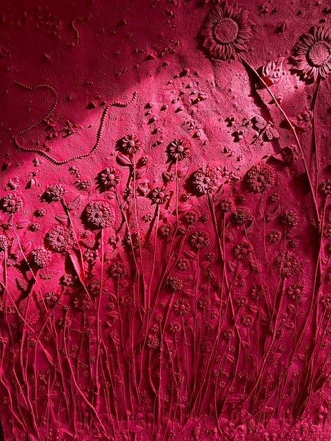 Red textured surface with floral embossing