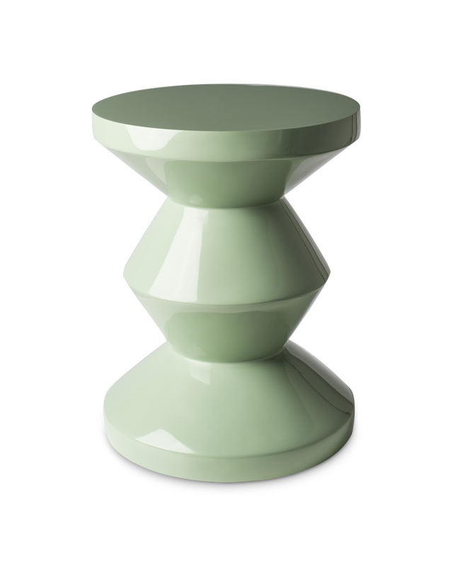 Green side table with geometric design on a white background