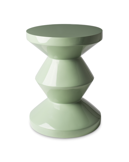 Green side table with geometric design on a white background
