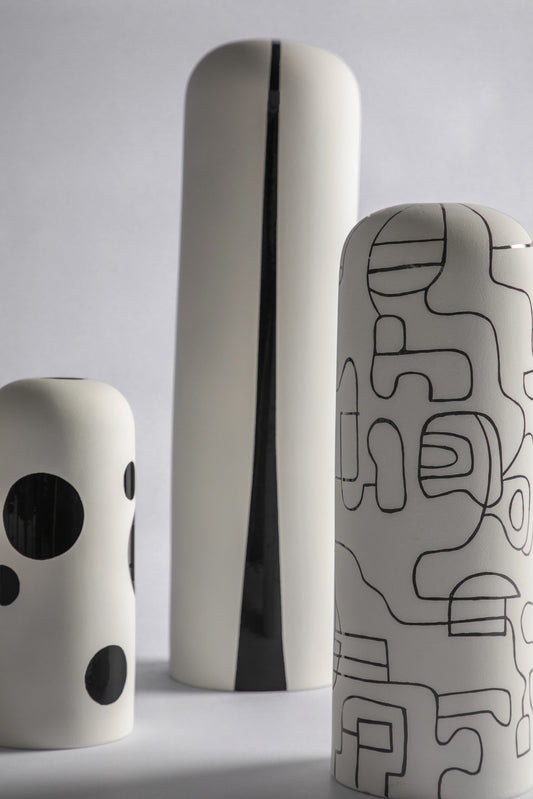 Waylande Gregory ceramic vase with thin black abstract line pattern on matte white glaze and 22k gold rim; handmade in Peru.