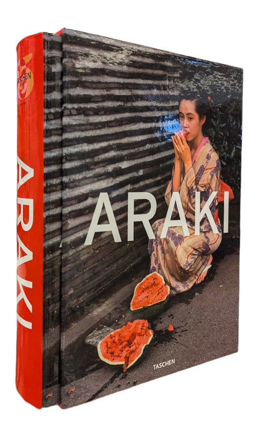 Book titled 'Araki' with a cover featuring a person and fruit, published by Taschen.