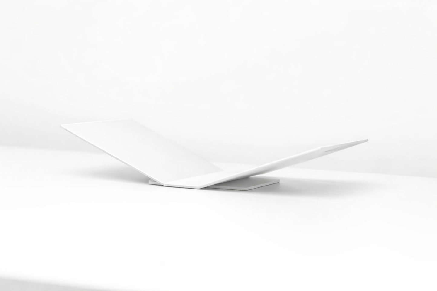 White metal book stand on a white background