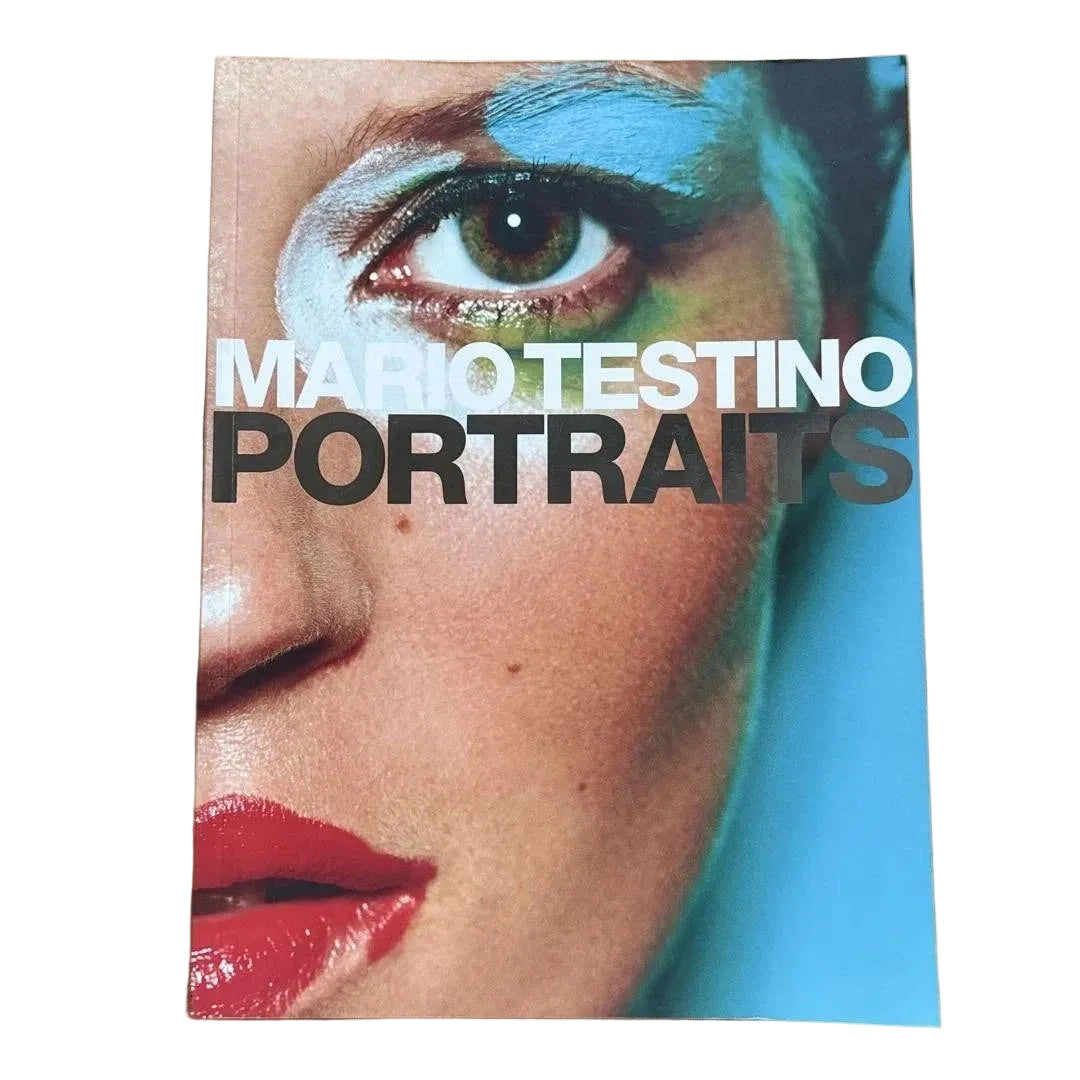 Book cover of 'Portraits' by Mario Testino with a close-up of a person's eye and red lips.