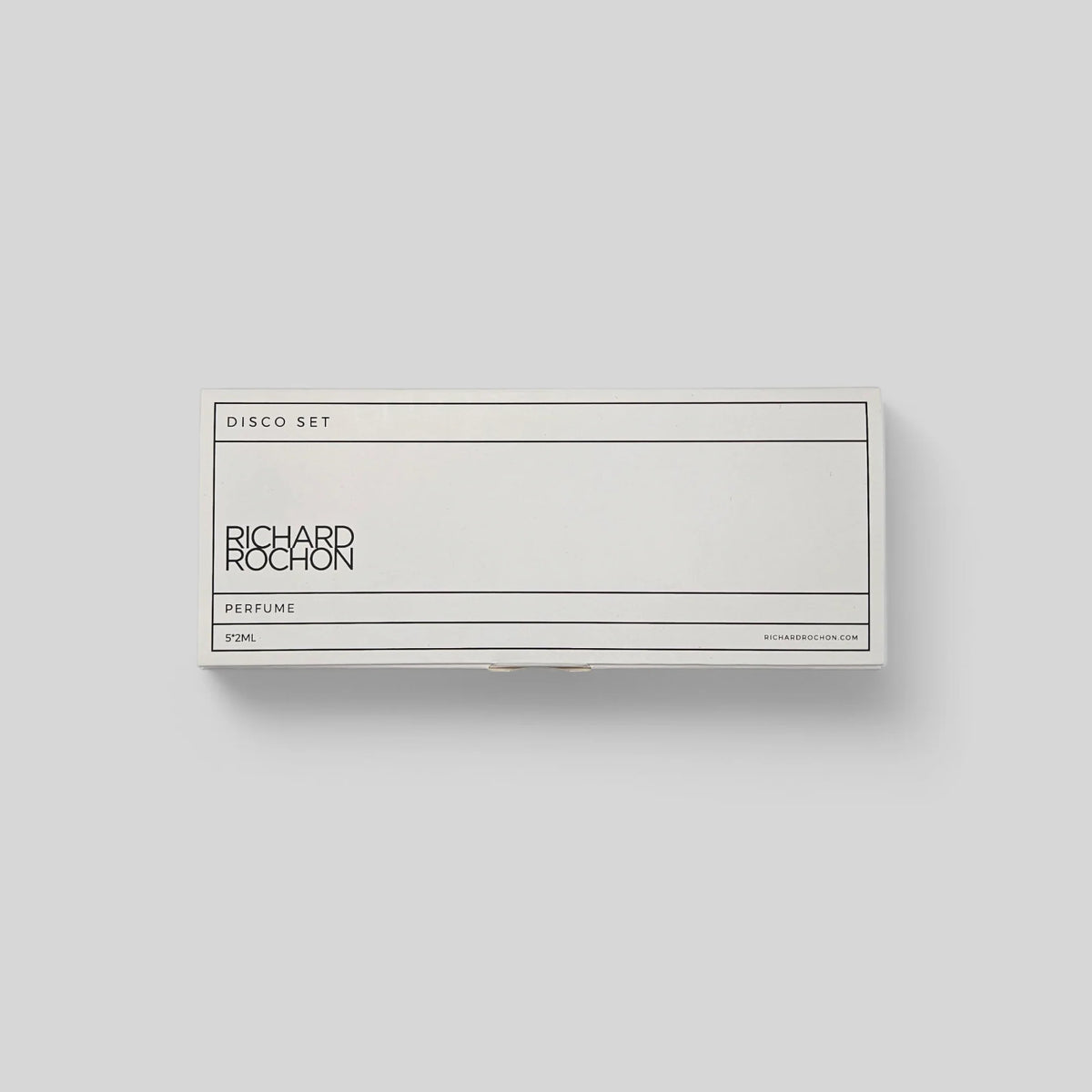 A rectangular perfume box for Richard Rochon 'VVM' on a light gray background. The box is white with black text and thin black border lines, labeled 'DISCO SET' and 'PERFUME'.