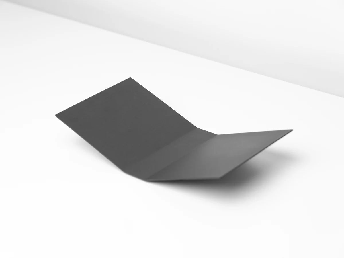 Black sheet of paper on a white background