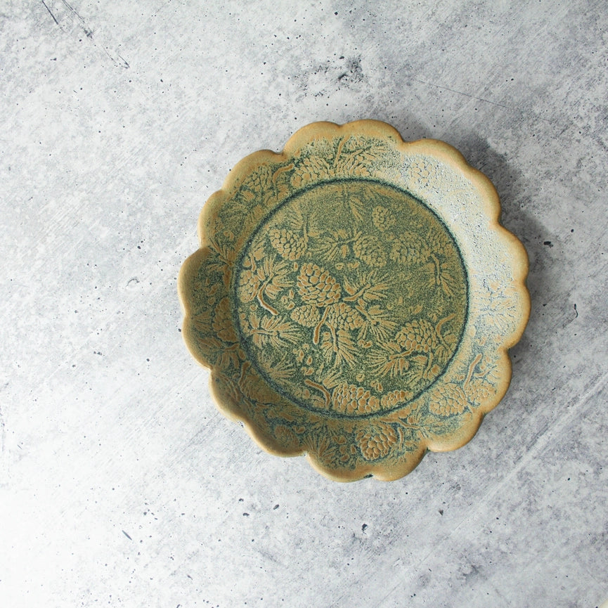 green yellow round plate texture on grey background