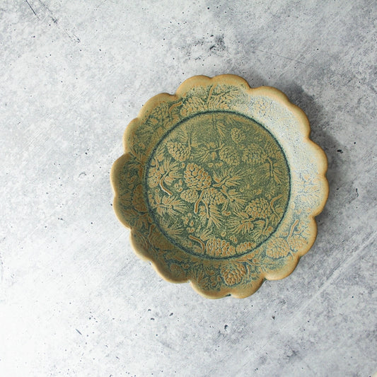 green yellow round plate texture on grey background