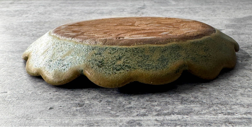 green yellow round plate texture on grey background