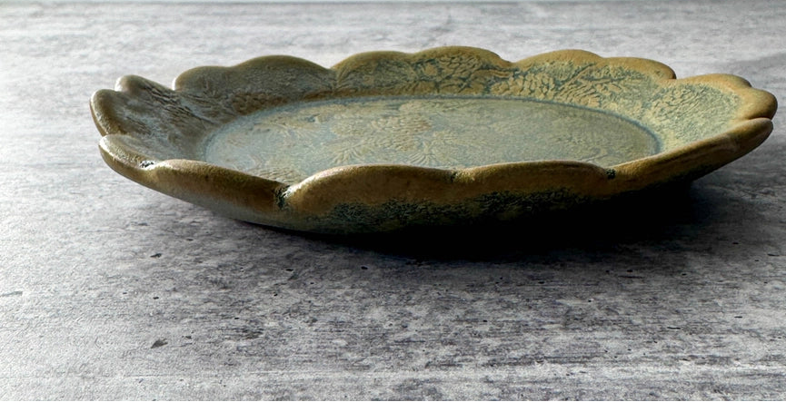 green yellow round plate texture on grey background