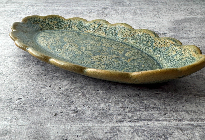 green scalloped edges tray on gray background