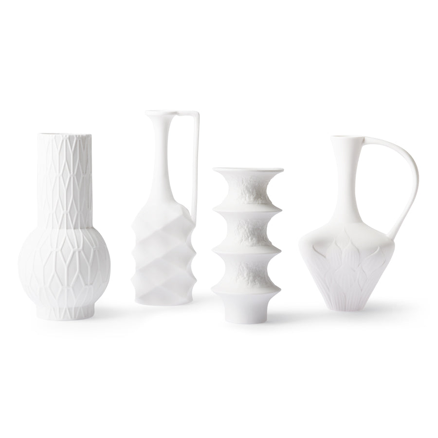 4 different white vases with textured details made from Dehua porcelain
