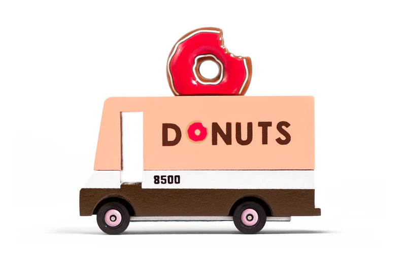 wooden donut food truck van with glazed donut on top