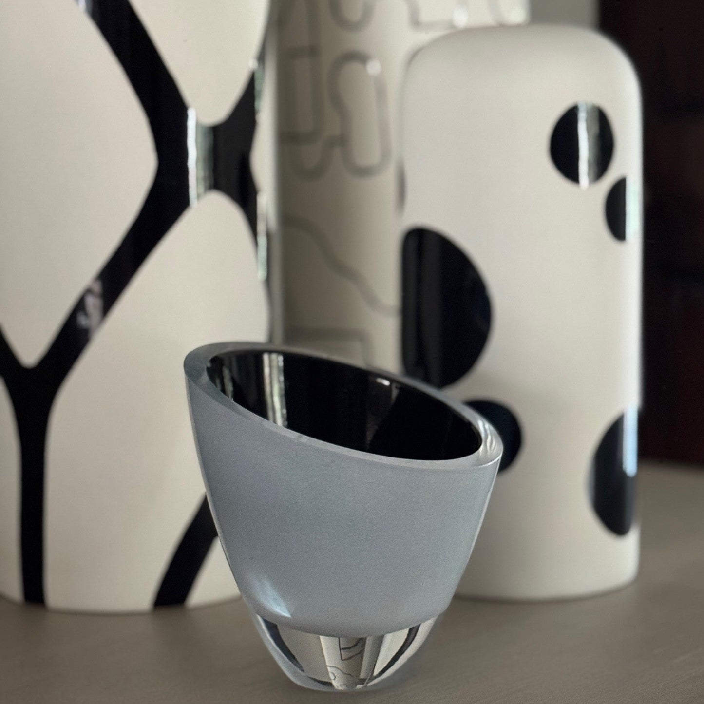 Decorative vases with abstract patterns on a neutral background