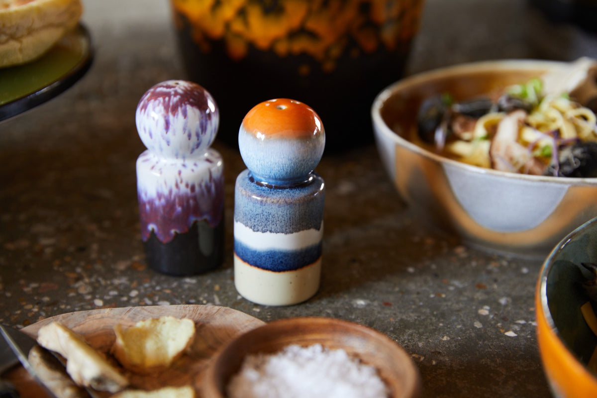 ceramic salt and pepper shakers in a kitchen setting