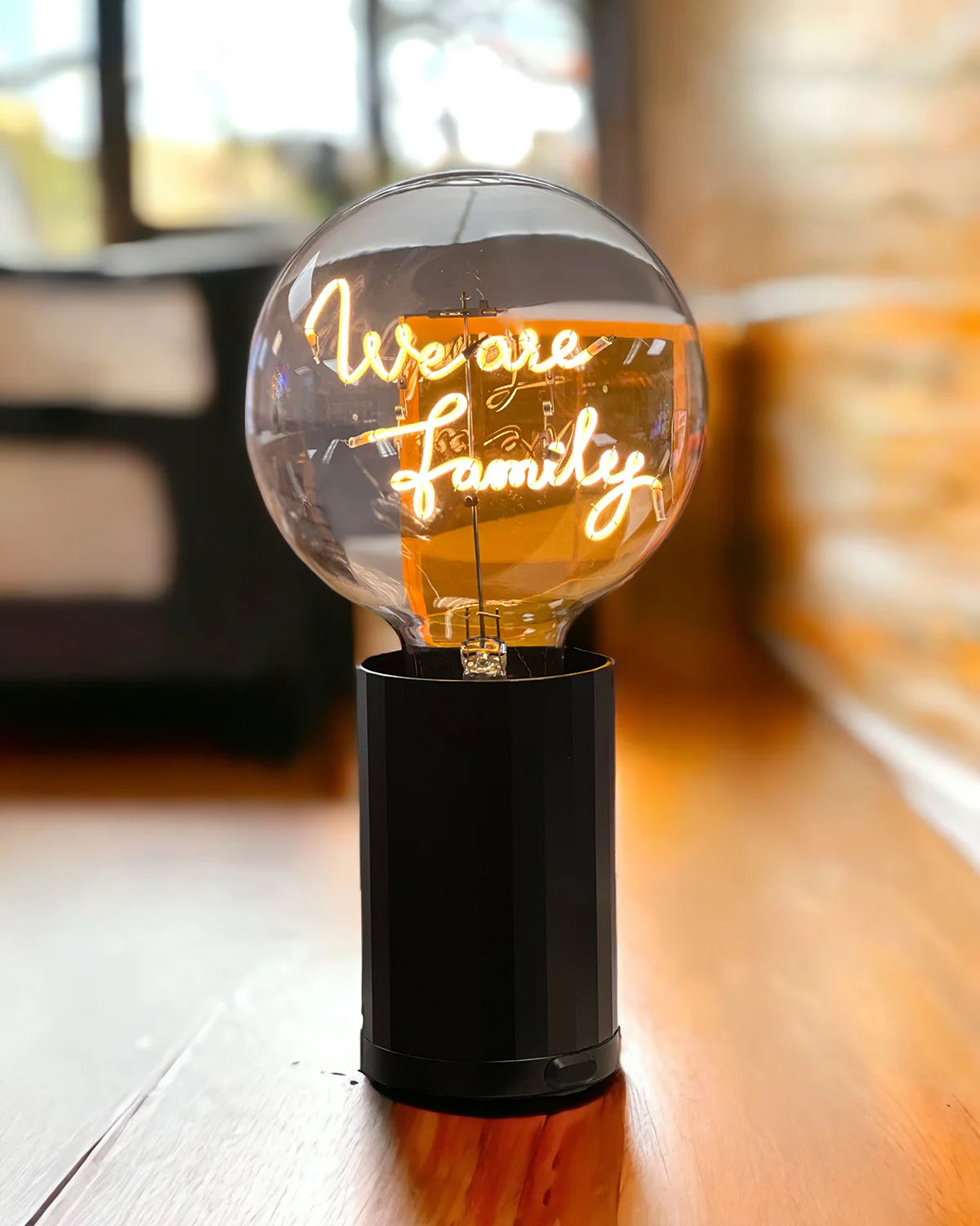 black base neon letters we are family table lamp