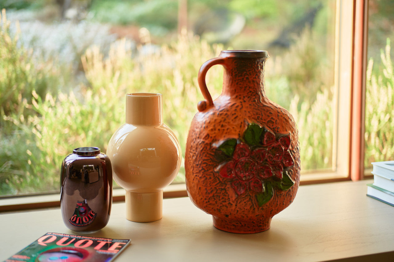 vintage and new vases in a window