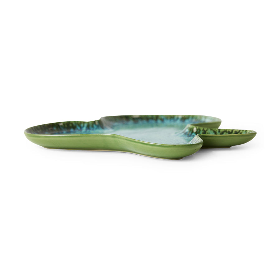 Two green ceramic trays with blue accents on a white background