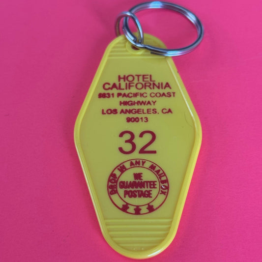 yellow colored retro  motel keychain hotel California