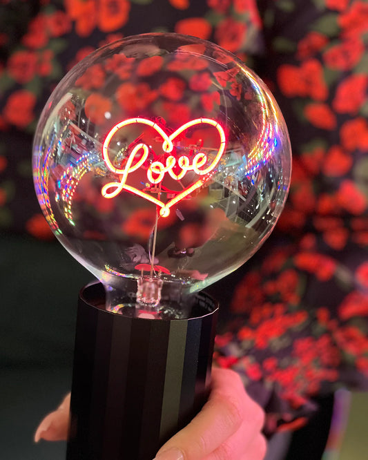 black base clear bulb with neon heart and love 