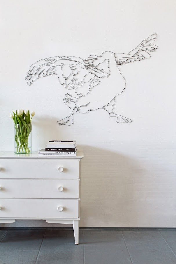 wall mural bird made from rope and nails