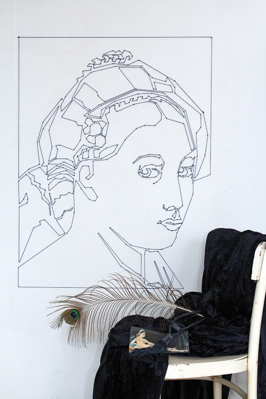 mural portrait made from rope and nails