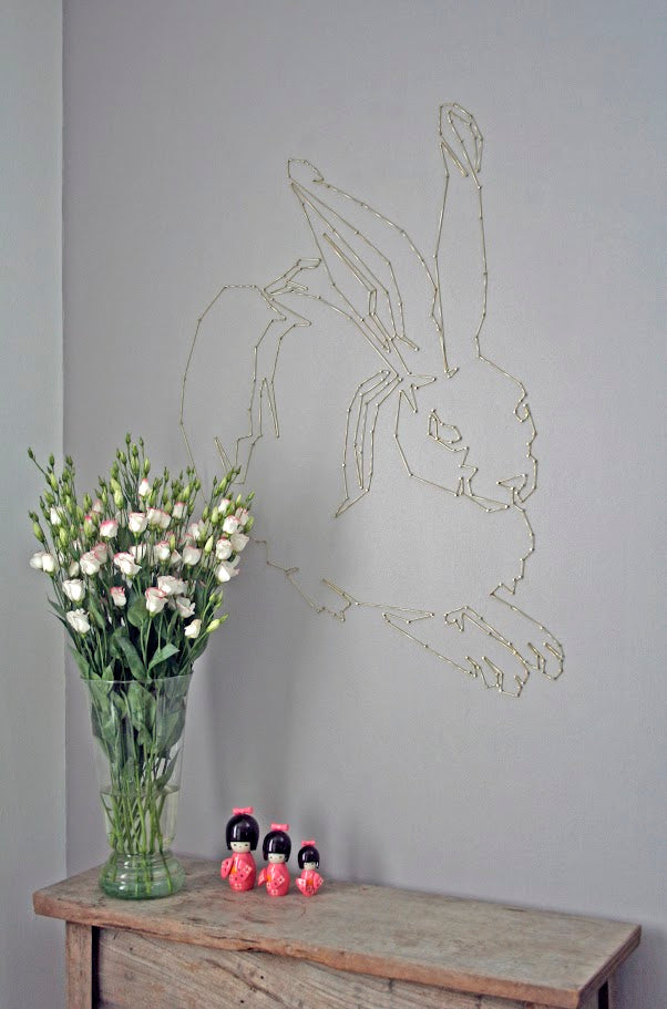 rope and nail mural of rabbit 