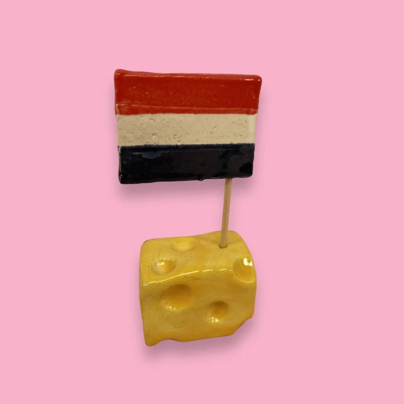 ceramics piece of cheese with red white and blue Dutch flag