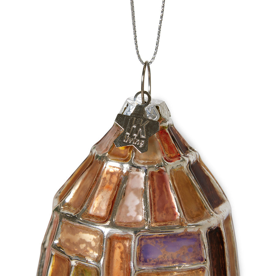 detail of glass Christmas ornament with silver and warm colors