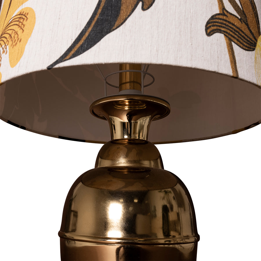 retro style table lamp with printed shade and brass colored base